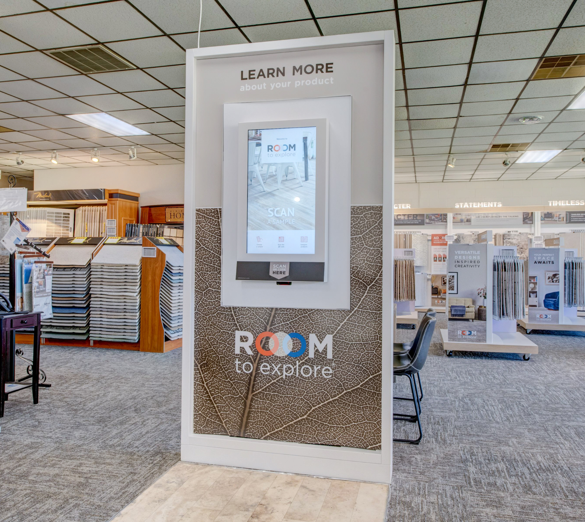 Women holding flooring sample in floor store 